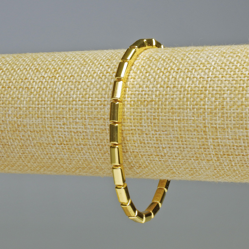 Náramek z hematitu, zlatý obdélníkový se zaoblenými hranami, průměr 8×4 mm, délka 18 cm, elastický