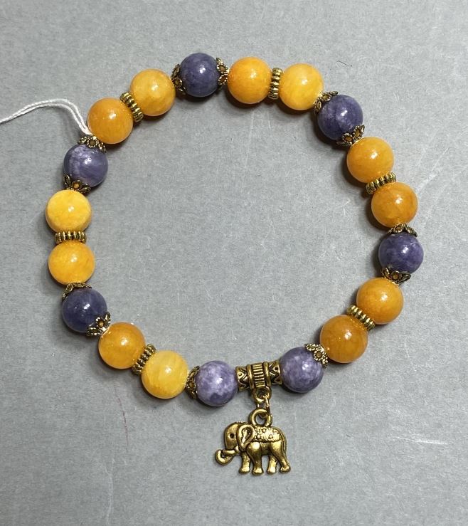 Náramek z hladkých akrylových kuliček o průměru 8 mm ± se kovovými vložkami, délka 18 cm ±, elastický