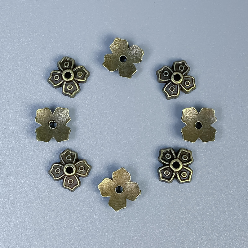 Bronzová čepička pro korálek, rozměry 7×1 mm ±, otvor 1 mm ±, balení 50 ks