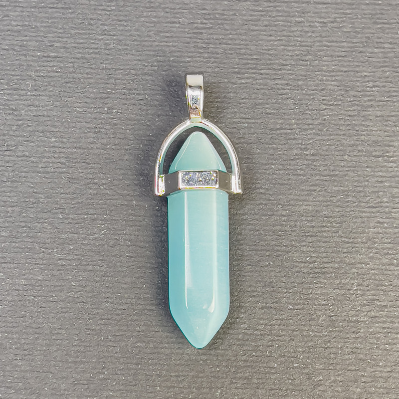 Přívěsek z kočičího oka azurově modrý, ve tvaru šestiúhelníku, krystalová koule o rozměrech 8 × 31 × 41 mm +