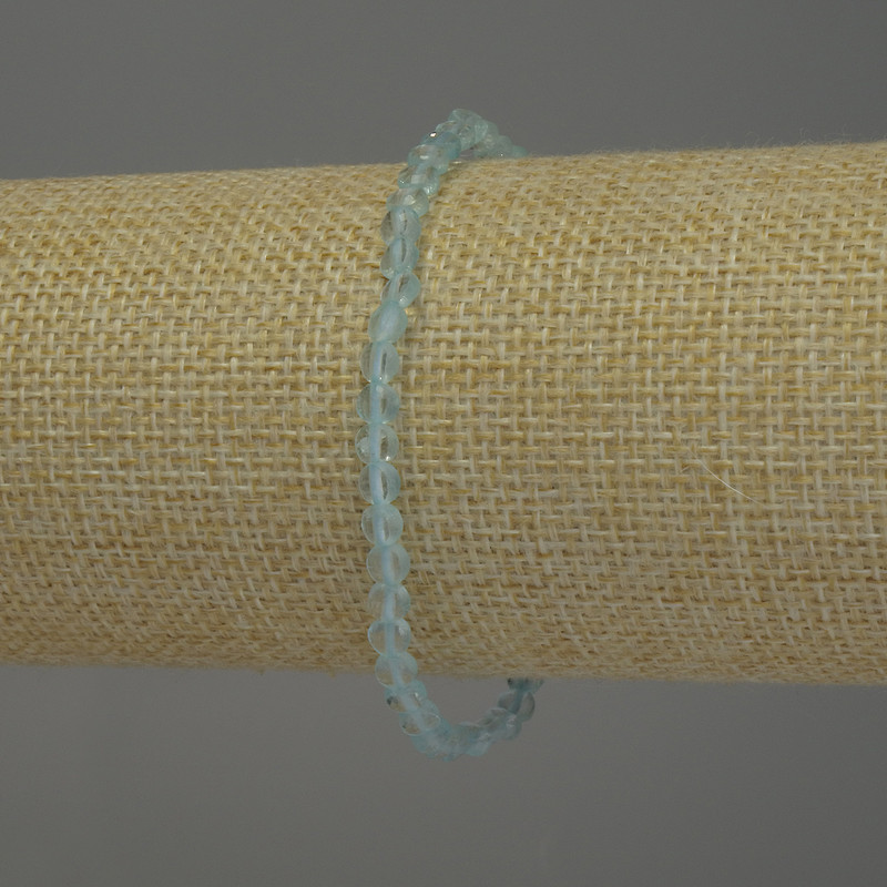 Náramek z přírodního topazu, fazetovaný korálek ve tvaru mince, průměr 4 mm, délka 18 cm, strečové provedení