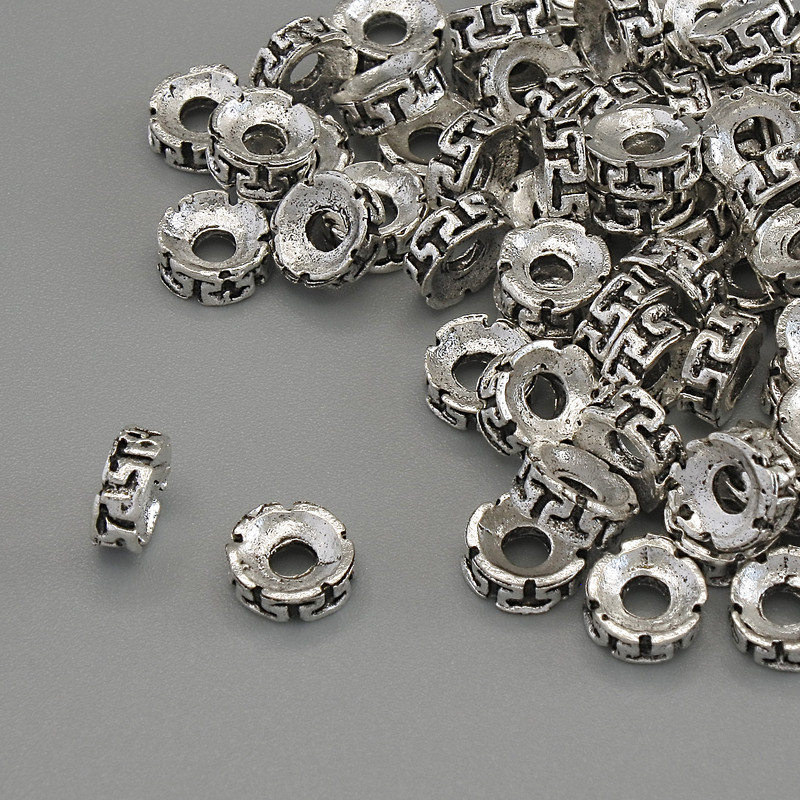 Stříbrná korálková vložka – barva kovu stříbrná, průměr 6×2 mm, otvor cca 2,3 mm, balení 20 g (~77 ks)