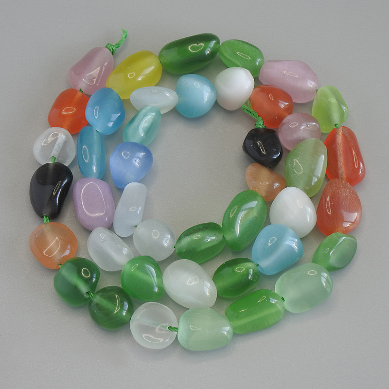 Barevné broušené korálky Kočičí oko, průměr 8–12×9 mm, délka cca 41 cm na niti