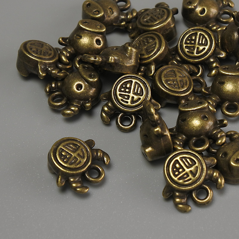 Фурнітура підвіска Бик колір металу бронза, розміри 10х9х5мм+- отвір, діаметр 1мм+- фасування 20гр (~17шт. )