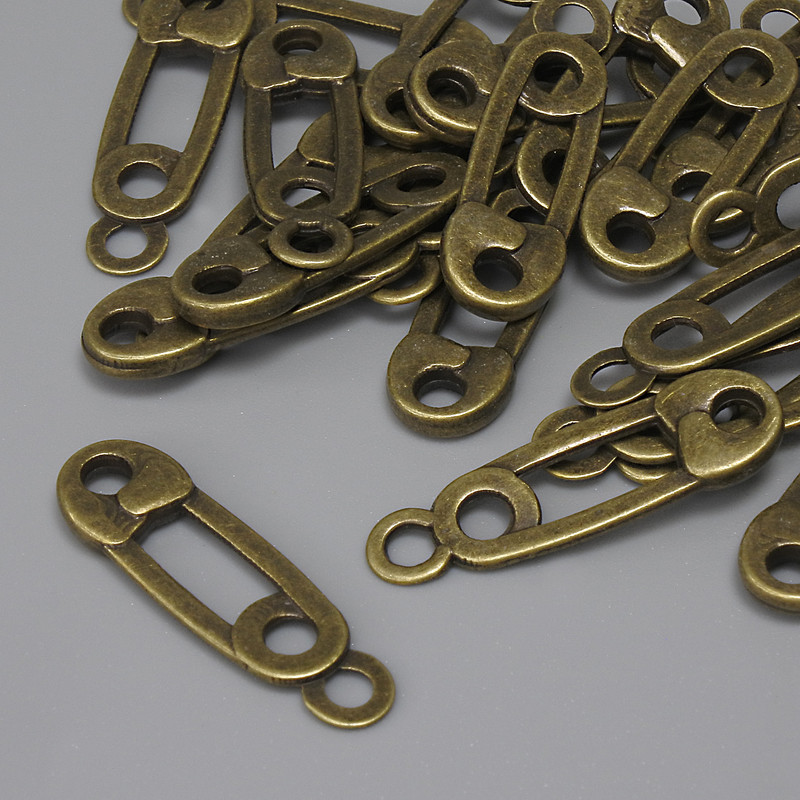 Přívěšek „Špička“ bronzové barvy, průměr 23×7 mm, otvor pro ucho 2,2 mm, balení 22 ks