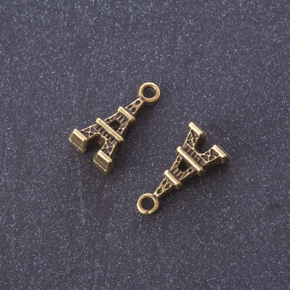 Přívěšek z kovových komponentů „Eiffelova věž“ barva kovu „bronz“ 1,6×0,8 cm balení 20 g ±19 ks