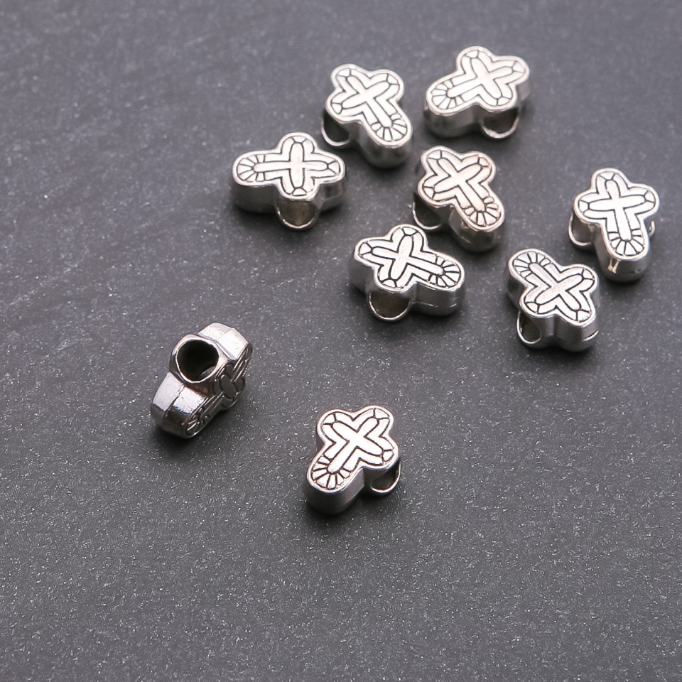 Pandora korálek 'Kříž', průměr díry 4,5 mm, rozměry 14×9 mm, balení 20 g ± 9 ks