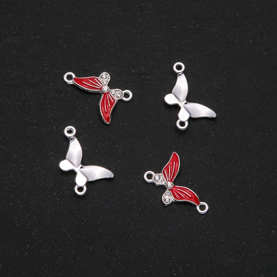 Konektor Motýlek s červeným smaltem 24×12 mm, balení 4 ks