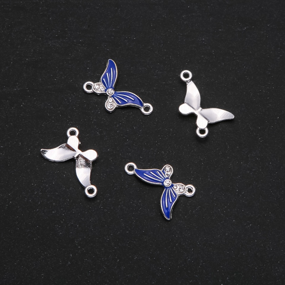 Konektor motýl modrý smalt 24×12 mm, balení 4 ks