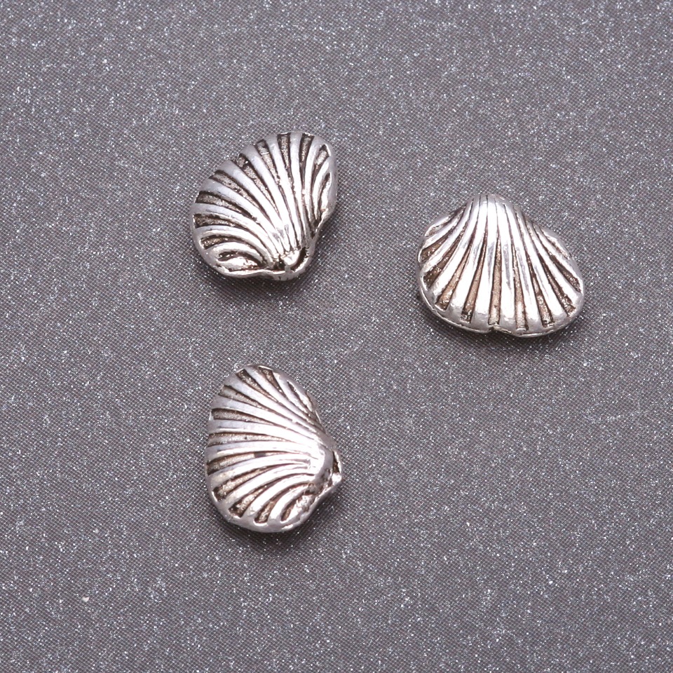 Bižuterní součástka – vložka do korálky, průměr 10×9 mm, vnitřní průměr cca 1,5 mm, hmotnost 20 g ±16 ks