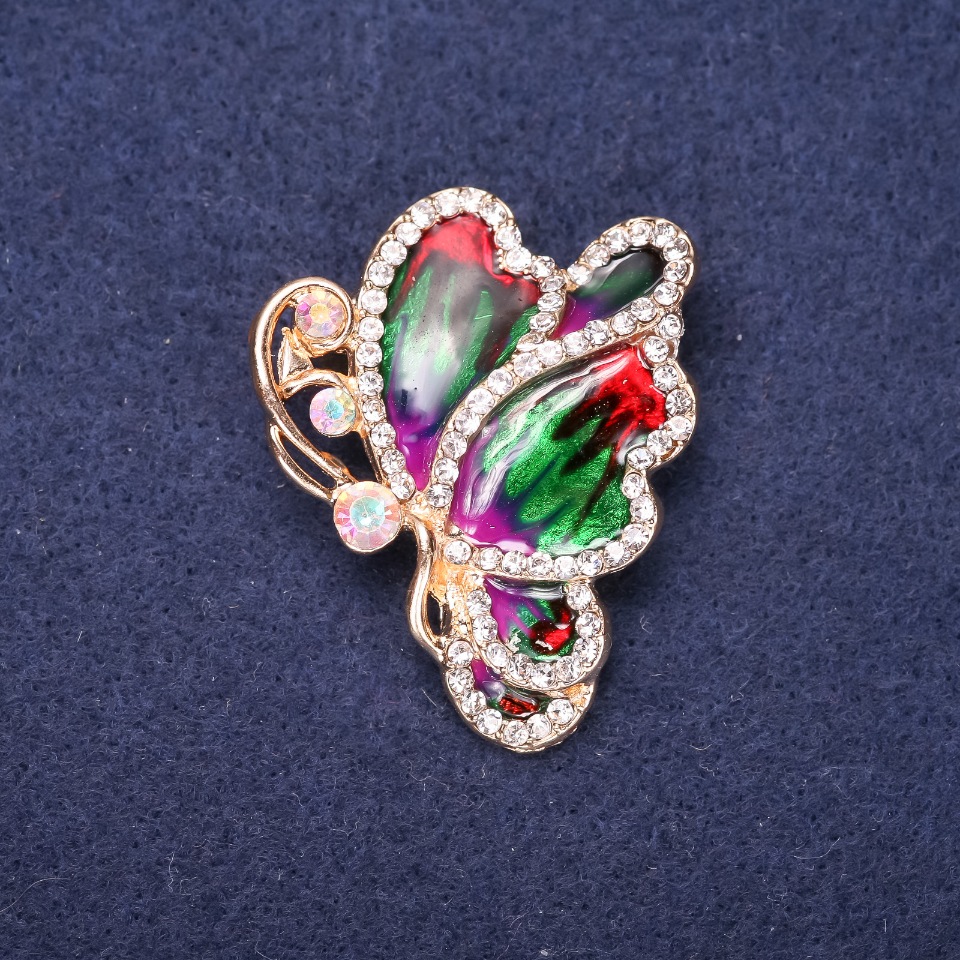 Brožka Motýlek se bílými štrasami a smaltem, 40×33 mm, žlutý kov