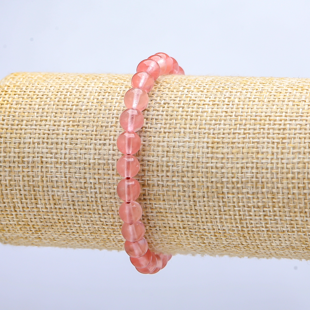 Náramek na gumičce z umělého chalcedonu, hladké kuličky, průměr 6(±) mm, délka 18 cm+