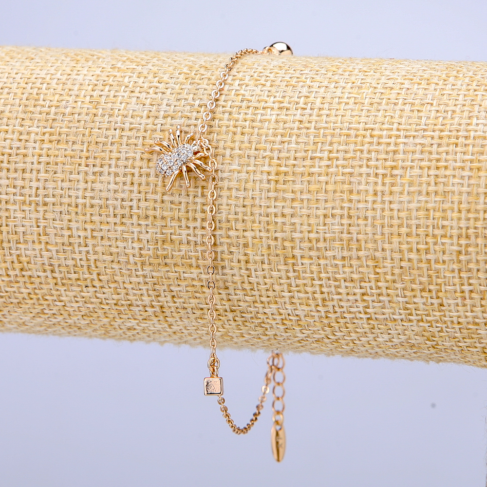 Náramek Xuping 18K pozlacení s bílými štrasami