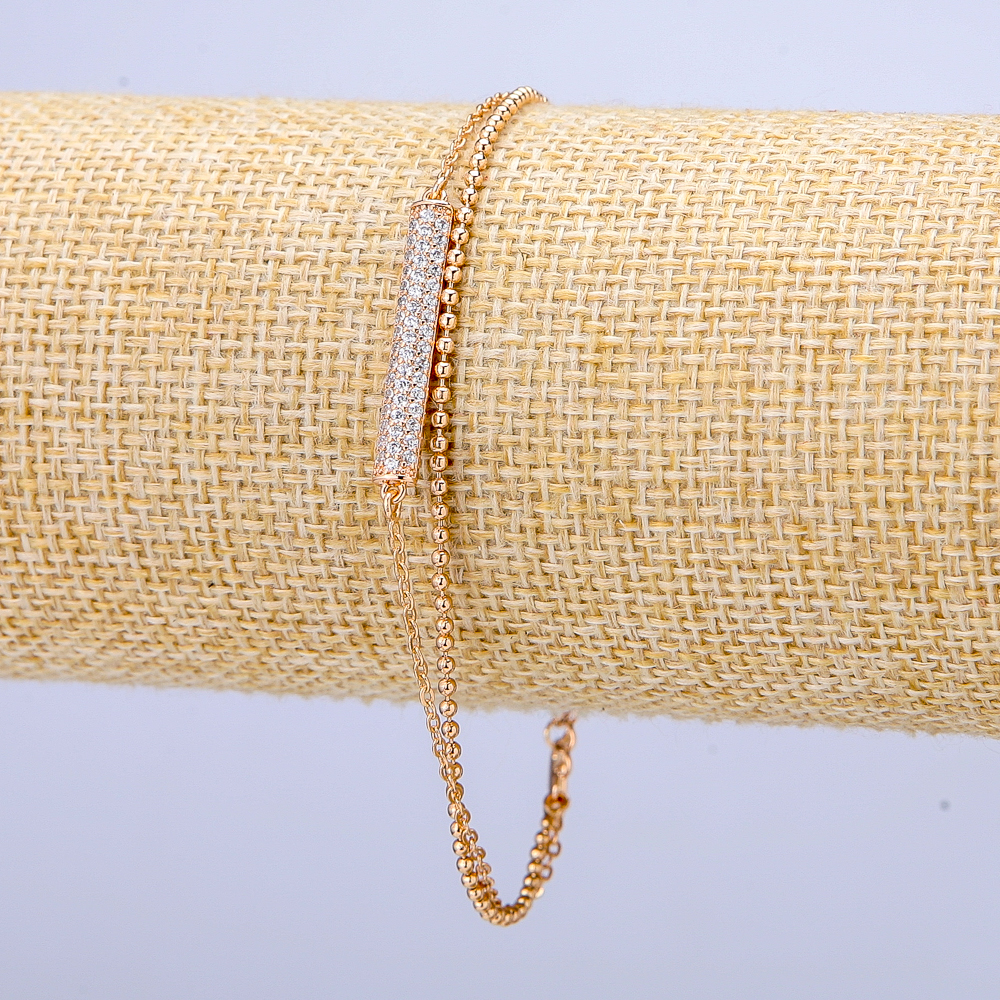 Náramek Xuping pozlacený 18K s bílými štrasami, tloušťka 3 mm, délka 18–21 cm