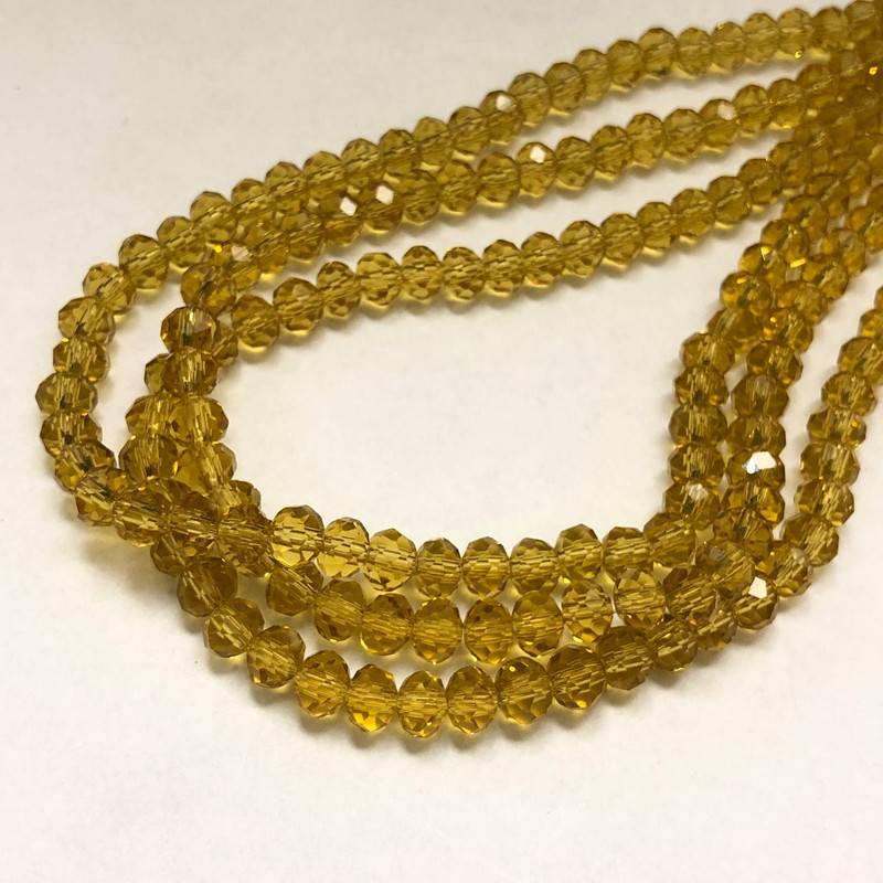 Korálky Český křišťál na niti oranžovo-meruňkové průhledné brusované rondely, průměr 6×4,5 mm, délka 38–40 cm +