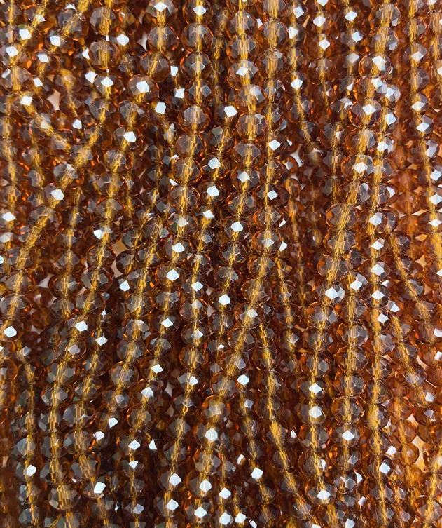Korálky českého křišťálu na vlascové šňůrce, hnědý průhledný brusovaný rondel, průměr 6×5 mm, délka 40–42 cm (+)