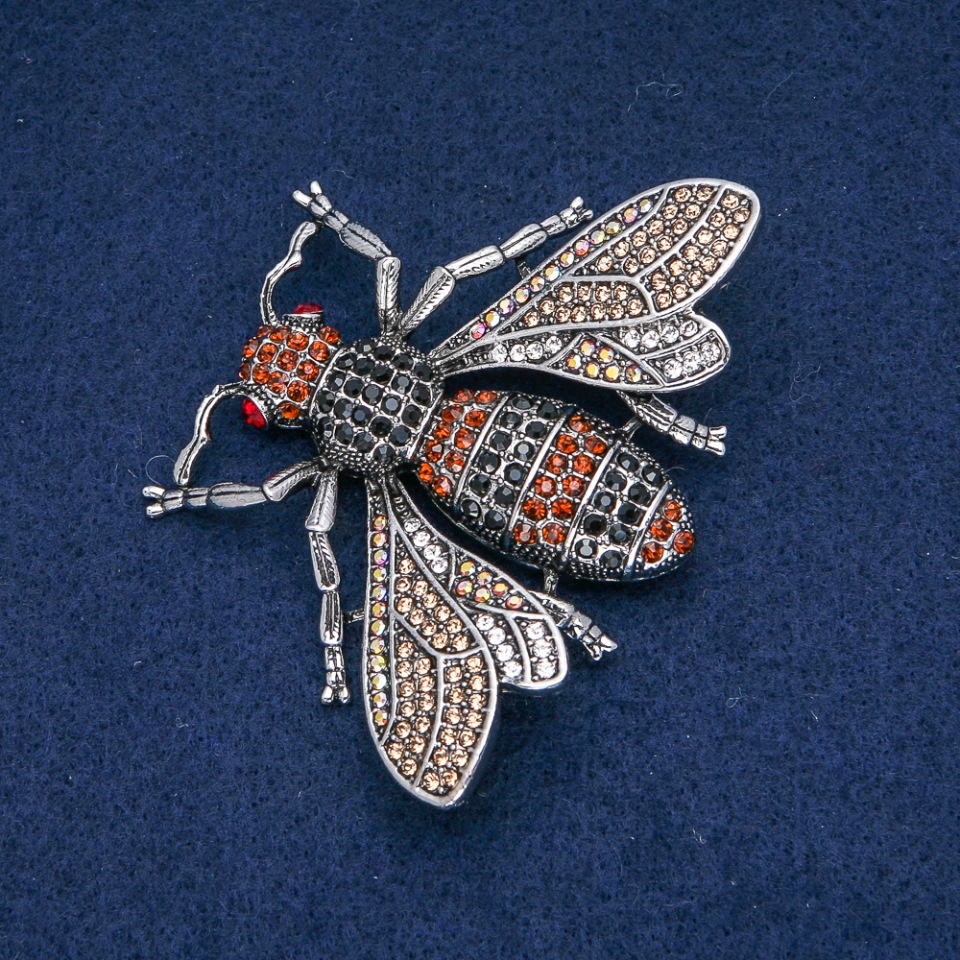 Brož Motýl zlaté, černé a benzínové štrasové kamínky, tmavě stříbrný kov 70×55 mm +