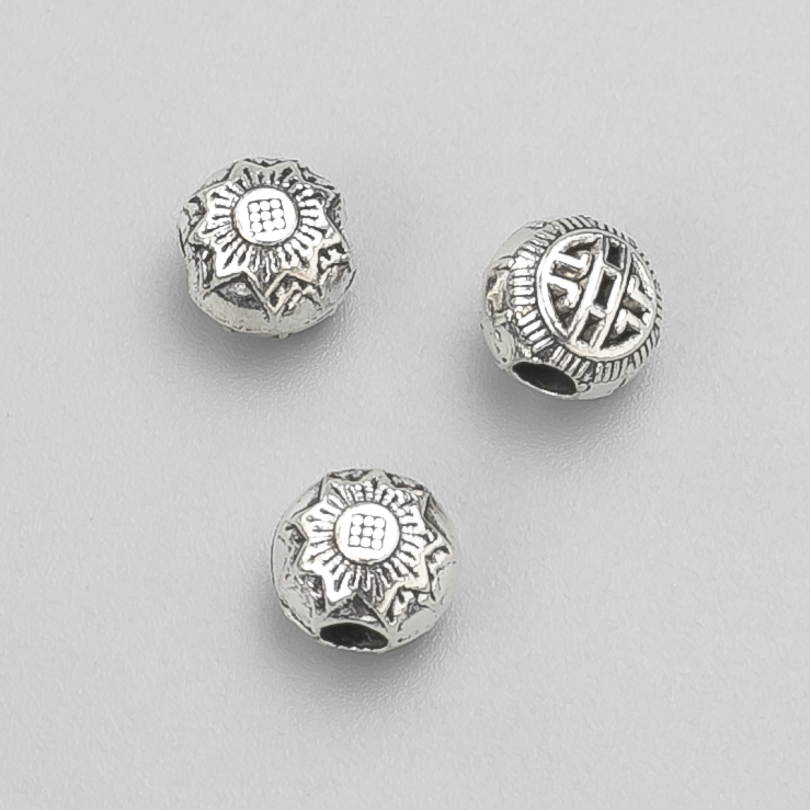 Kovová komponenta – korálka-vložka, průměr 8×7 mm ±, balení 20 g, 19 ks ±, barva kovu 'stříbro'