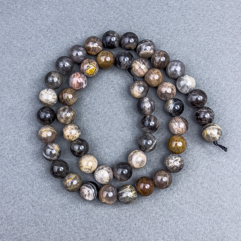 Korálky ze slunečního kamene, přírodní, hladké kuličky, průměr 8,5 mm, na niti, délka cca 39 cm