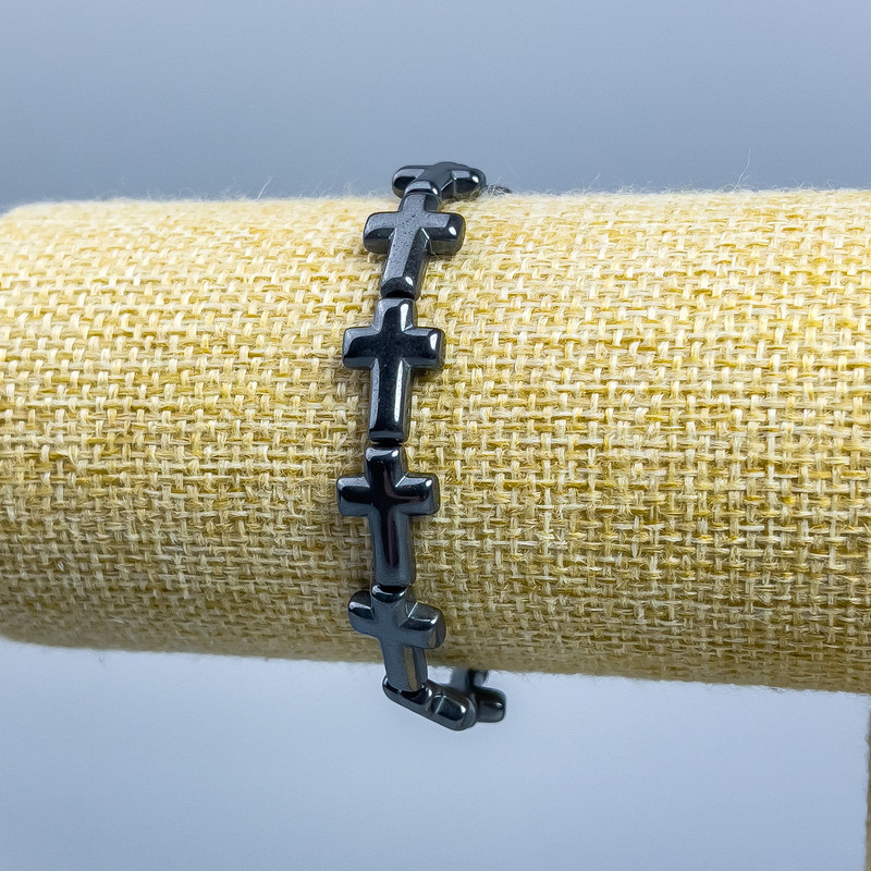 Náramek hematitový Kříž, průměr 14×10 mm ±, délka 18 cm (pružný)